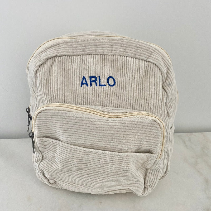 blue thread on snow backpack